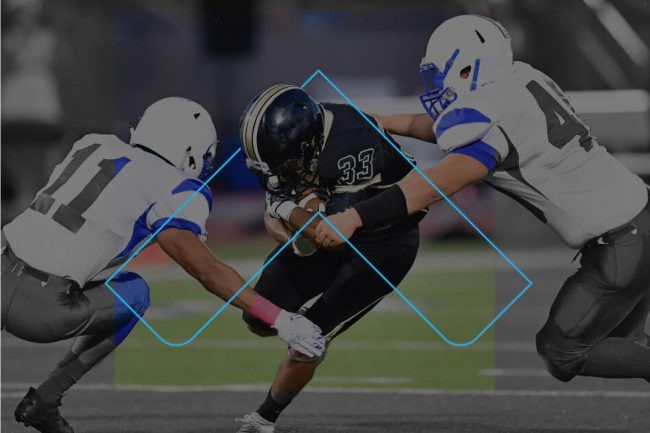 Football players competing on the field, symbolizing the competitive and strategic services offered by a marketing agency in Riyadh.