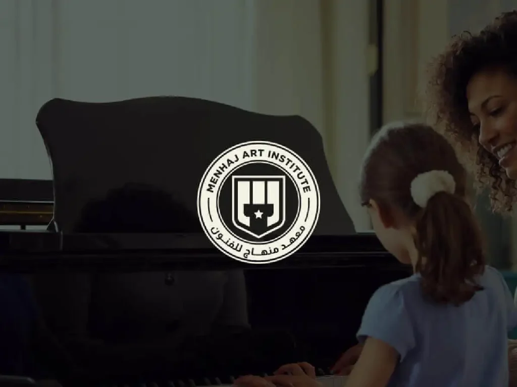 Instructor teaching a young student to play piano at Minhaj Music, supported by Social Media Management from a leading Social Media Agency and Social Media Marketing Agency