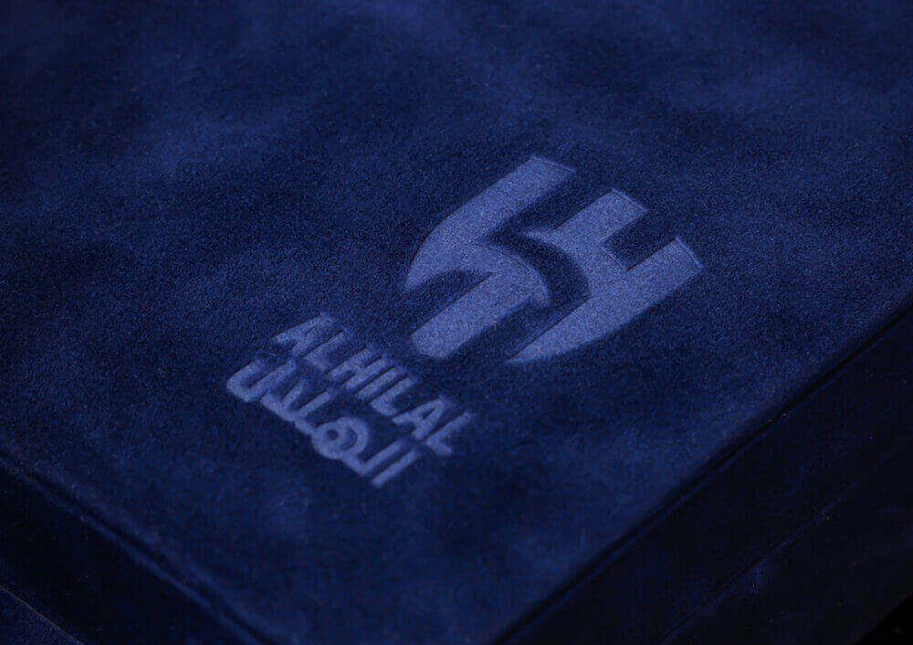 Al Hilal SFC logo on dark blue velvet, crafted by a full-service digital marketing agency and advertising company in Riyadh.